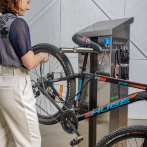 Woman using a bike repair station